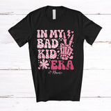 MacnyStore - Personalized Custom Name In My Bad Kid Era; Cheerful Mother's Day Pink Flower Skeleton Hand T-Shirt