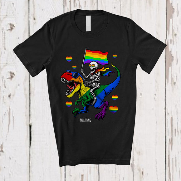 MacnyStore - Personalized Custom Name LGBT Skeleton Riding T-Rex; Humorous LGBTQ Flag Pride Rainbow T-Shirt