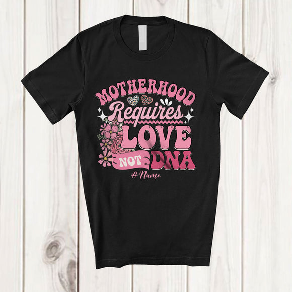MacnyStore - Personalized Custom Name Motherhood Requires Love Not A DNA; Amazing Mother's Day Flowers T-Shirt