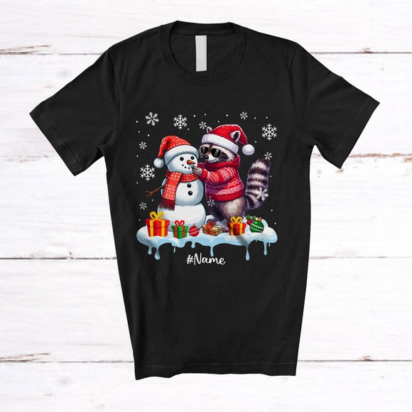 MacnyStore - Personalized Custom Name Raccoon Build Snowman; Lovely Snow Santa Raccoon; Family T-Shirt