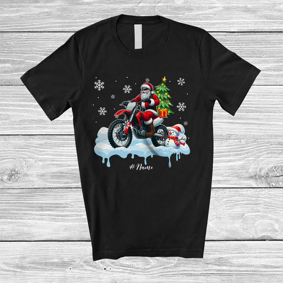 MacnyStore - Personalized Custom Name Santa Carrying Christmas Tree On Dirt Bike; Joyful Snowman Driver T-Shirt