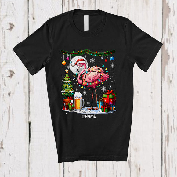 MacnyStore - Personalized Custom Name Santa Flamingo Drinking Beer; Amusing Christmas Lights Snow Drunker T-Shirt