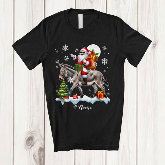 MacnyStore - Personalized Custom Name Santa Riding A Donkey; Amazing Christmas Snow Donkey Farm Farmer T-Shirt