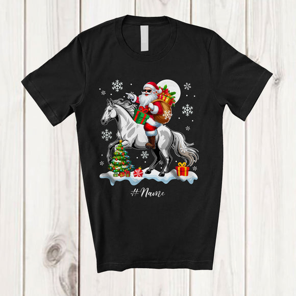 MacnyStore - Personalized Custom Name Santa Riding A Horse; Amazing Christmas Snowing Horse Farm Farmer T-Shirt