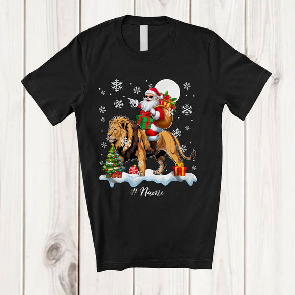 MacnyStore - Personalized Custom Name Santa Riding A Lion; Amazing Christmas Snowing Lion Wild Animal T-Shirt