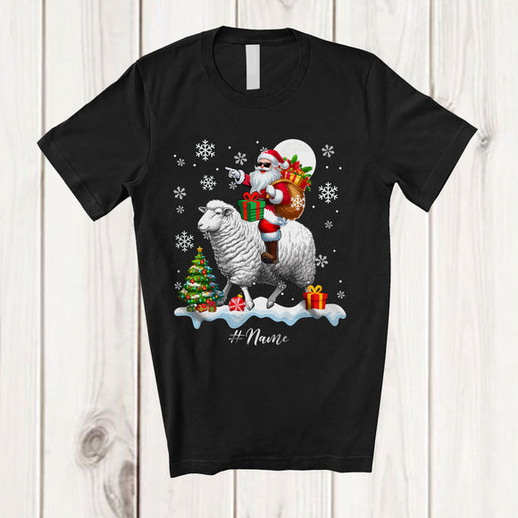 MacnyStore - Personalized Custom Name Santa Riding A Sheep; Amazing Christmas Snowing Sheep Farm Farmer T-Shirt