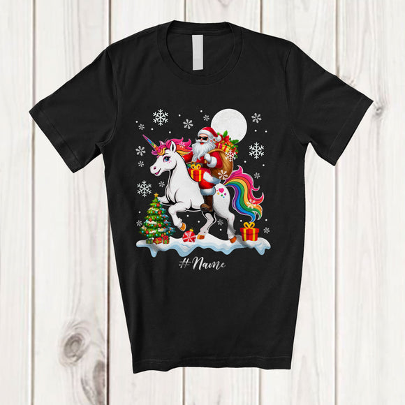 MacnyStore - Personalized Custom Name Santa Riding A Unicorn; Amazing Christmas Snowing Unicorn Lover T-Shirt