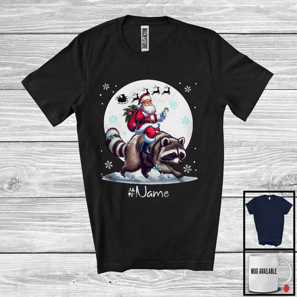 MacnyStore - Personalized Custom Name Santa Riding Raccoon, Merry Christmas Moon Snow Raccoon, X-mas T-Shirt
