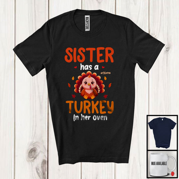 MacnyStore - Personalized Custom Name Sister Has A Turkey In Her Oven; Lovely Thanksgiving Pregnancy Family T-Shirt