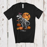 MacnyStore - Personalized Custom Name Skeleton T-Rex Holding Pumpkin Candy; Scary Halloween Moon Dinosaur T-Shirt