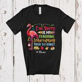 MacnyStore - Personalized Custom Name Teaching Interrupting Your Talking; Lovely Back To School Flamingo Teacher T-Shirt