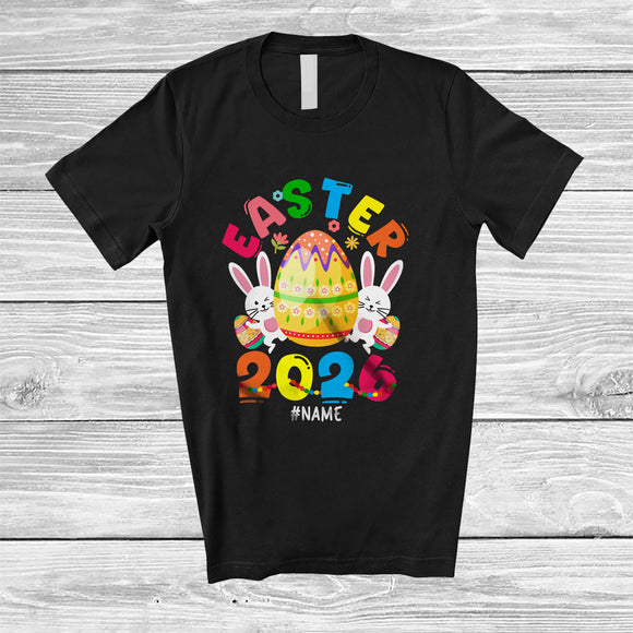 MacnyStore - Personalized Easter 2026; Lovely Easter Eggs Hunting Bunny; Custom Name Family Group T-Shirt