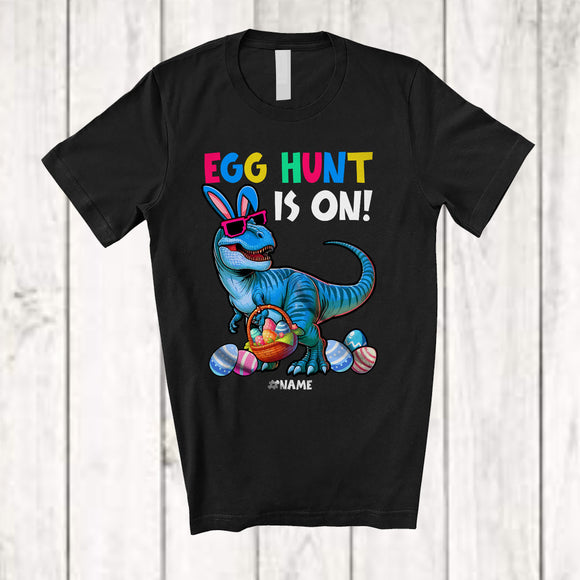 MacnyStore - Personalized Egg Hunt Is ON; Awesome Easter Bunny T-Rex Hunting Eggs; Custom Name Family T-Shirt
