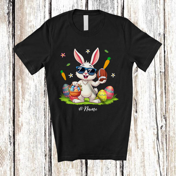 MacnyStore - Personalized Happy Easter; Joyful Bunny Playing Football; Custom Name Player Egg Hunting T-Shirt
