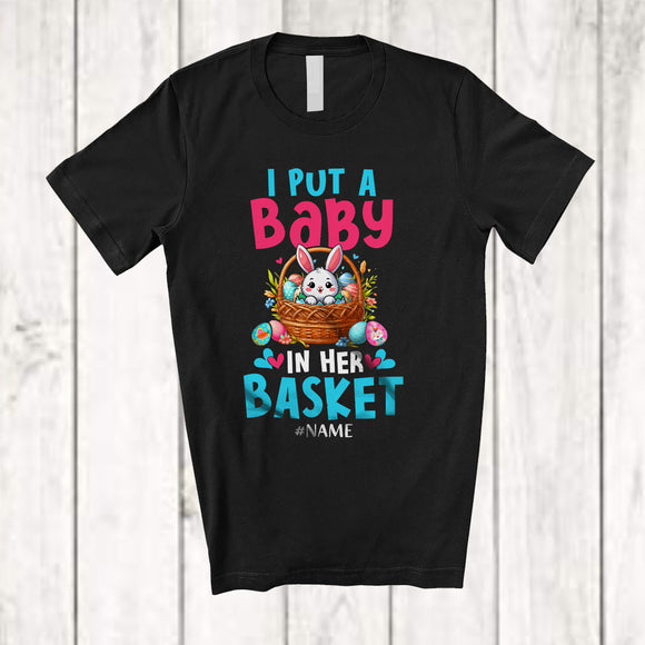 MacnyStore - Personalized I Put A Baby In Her Basket; Lovely Pregnancy Easter Custom Name Bunny In Egg Basket T-Shirt
