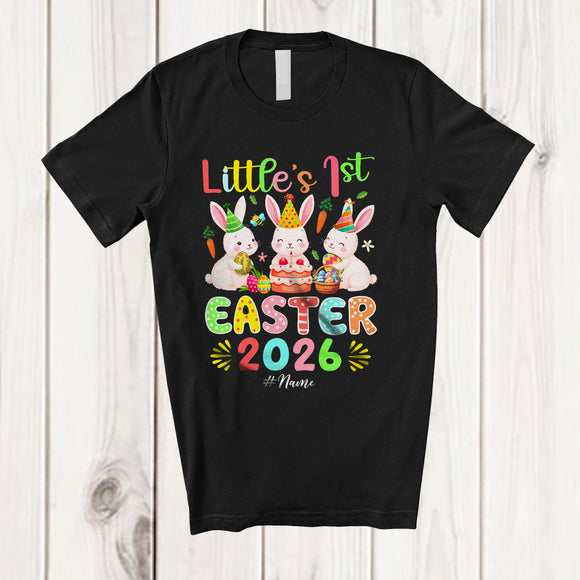 MacnyStore - Personalized Little's 1st Easter 2026; Joyful Birthday Three Bunnies Eggs Hunt; Custom Name Family T-Shirt