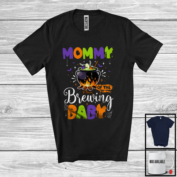 MacnyStore - Personalized Mommy Of The Brewing Baby, Humorous Halloween Pregnancy Custom Name, Witch Family T-Shirt