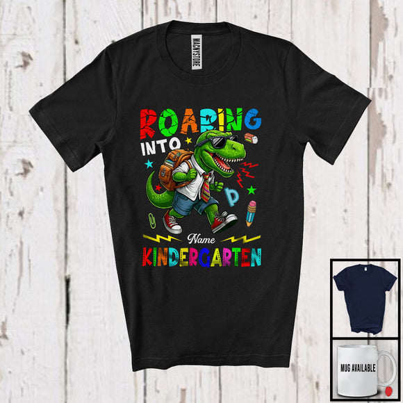 MacnyStore - Personalized Roaring Into Kindergarten, Amazing First Day Of School T-Rex Dinosaur, Custom Name T-Shirt