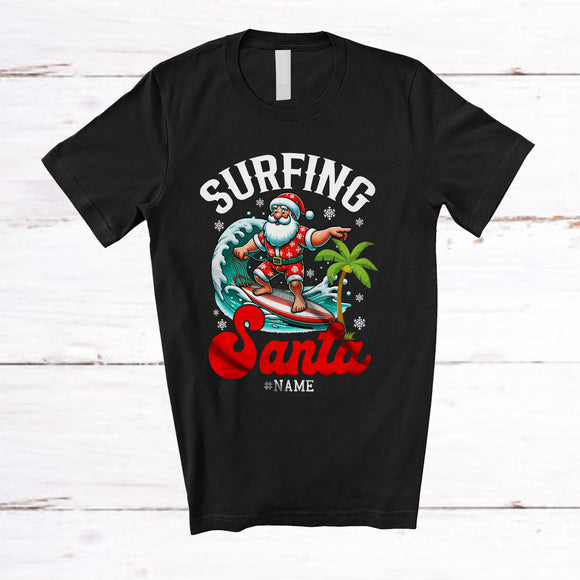MacnyStore - Personalized Surfing Santa; Amusing Christmas in July Santa Custom Name Surfer; Beach T-Shirt