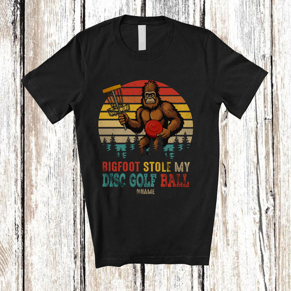 MacnyStore - Personalized Vintage Retro Bigfoot Stole My Disc Golf Ball; Joyful Sasquatch Custom Name Player T-Shirt