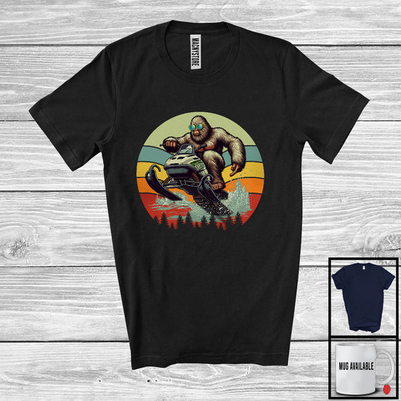MacnyStore - Vintage Retro Bigfoot Riding Snowmobiling, Humorous Bigfoot Lover, Snowmobiling Family Group T-Shirt