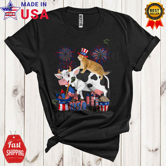 MacnyStore - Cat Riding Cow Funny Cool 4th Of July American Flag Fireworks Cat Farmer Farm Animal Lover T-Shirt