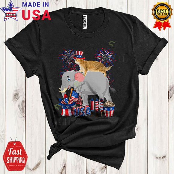 MacnyStore - Cat Riding Elephant Funny Cool 4th Of July American Flag Fireworks Cat Wild Animal Lover T-Shirt