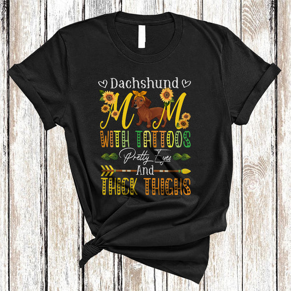 MacnyStore - Dachshund Mom With Tattoos Pretty Eyes And Thick Thighs, Lovely Mother's Day Sunflowers, Family T-Shirt