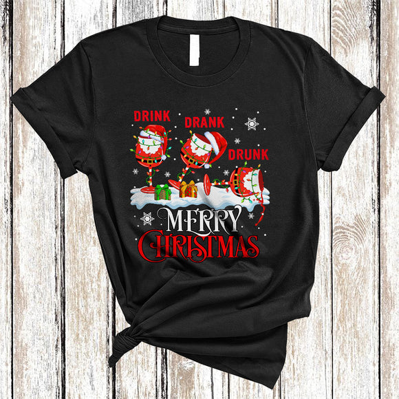 MacnyStore - Drink Drank Drunk Merry Christmas, Humorous Three Santa Wine Glasses, X-mas Snow Around T-Shirt