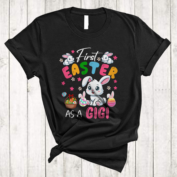 MacnyStore - First Easter As A Gigi, Lovely Easter Pregnancy Announcement, Flowers Bunny Eggs Hunting T-Shirt