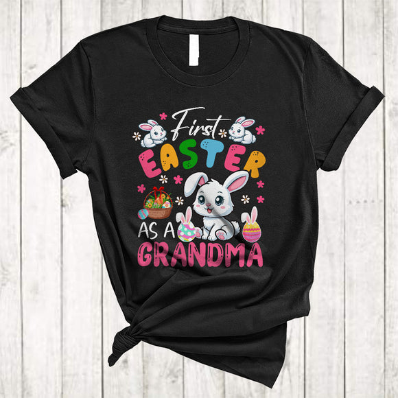 MacnyStore - First Easter As A Grandma, Lovely Easter Pregnancy Announcement, Flowers Bunny Eggs Hunting T-Shirt