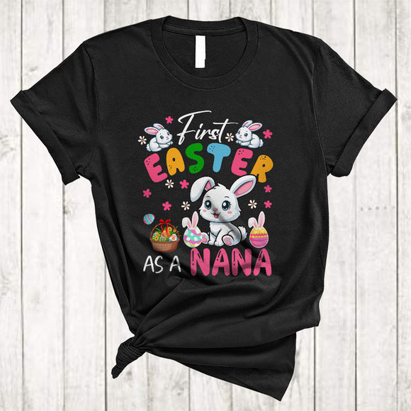 MacnyStore - First Easter As A Nana, Lovely Easter Pregnancy Announcement, Flowers Bunny Eggs Hunting T-Shirt