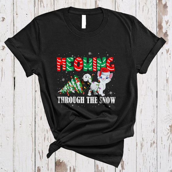 MacnyStore - Meowing Through Snow, Adorable Christmas Santa Kitten X-mas Tree, Snow Around Animal T-Shirt