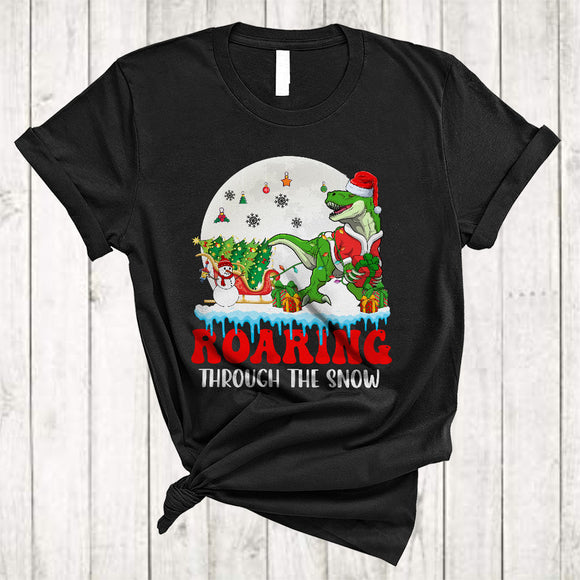 MacnyStore - Roaring Through The Snow, Lovely Merry Christmas Santa T-Rex, X-mas Sleigh Dinosaur Lover T-Shirt