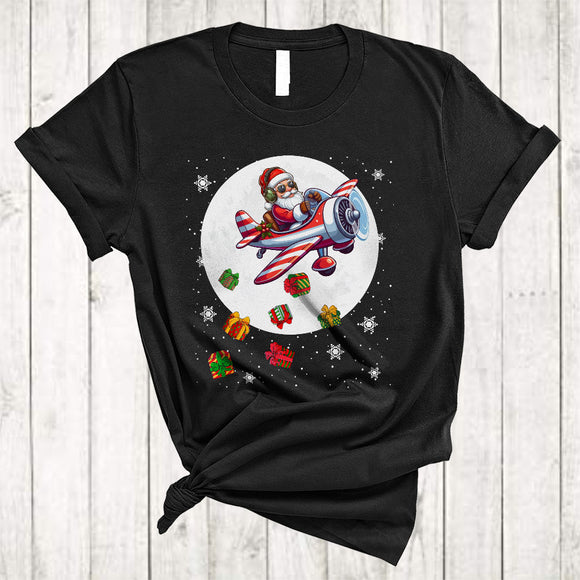 MacnyStore - Santa Flying On Airplane, Humorous Christmas Santa Airplane Lover, X-mas Moon Snow Around T-Shirt