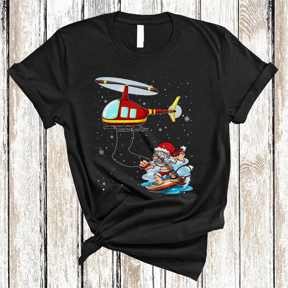 MacnyStore - Santa Helicopter Sleigh Surfboard, Cool Christmas In July Summer Vacation, Santa On Beach Snow T-Shirt