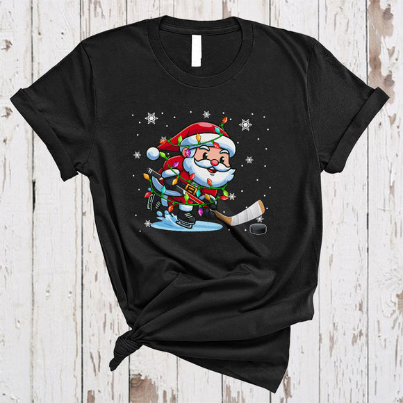 MacnyStore - Santa Playing Ice Hockey, Joyful Christmas Sport Player Team Lover, X-mas Lights Snow Around T-Shirt