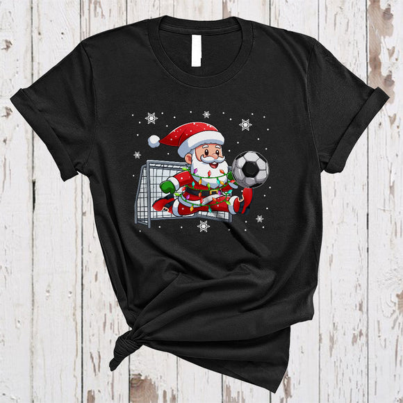 MacnyStore - Santa Playing Soccer, Joyful Christmas Sport Player Team Lover, X-mas Lights Snow Around T-Shirt