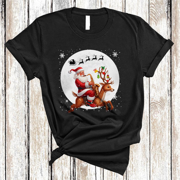 MacnyStore - Santa Riding Reindeer Playing Saxophone, Joyful Funny Christmas Musical Instruments, X-mas Family T-Shirt