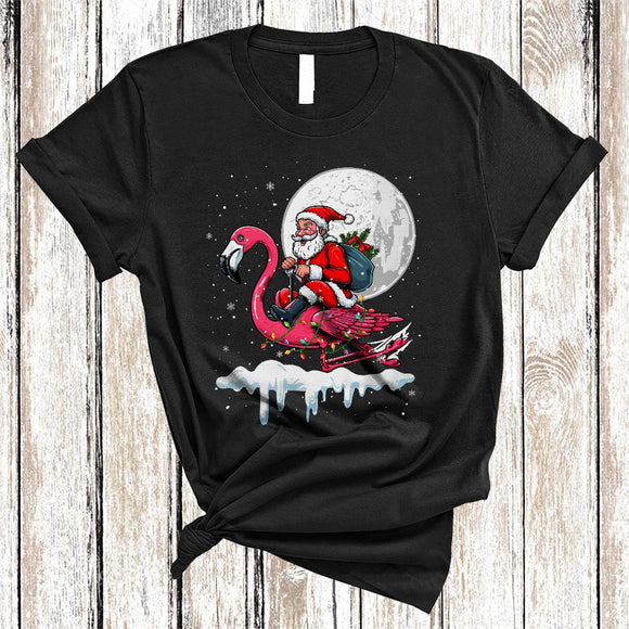 MacnyStore - Santa Riding Flamingo Reindeer, Humorous Christmas Santa Flamingo, X-mas Lights Animal Lover T-Shirt