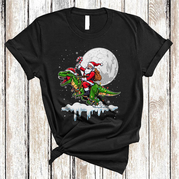 MacnyStore - Santa Riding T-Rex Reindeer, Humorous Christmas Santa T-Rex, X-mas Lights Animal Lover T-Shirt