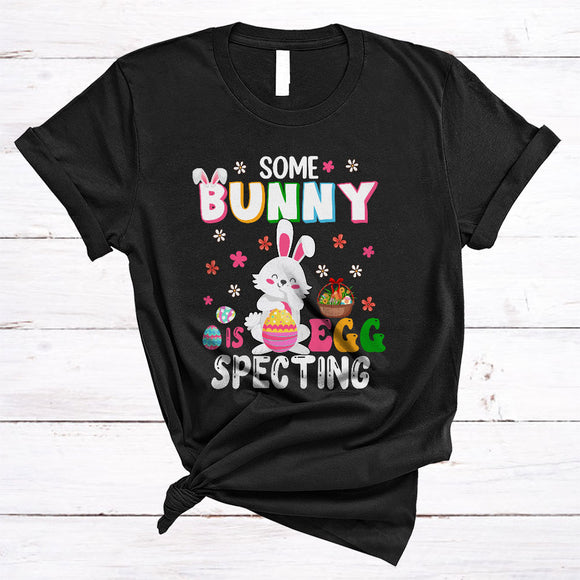 MacnyStore - Some Bunny Is Eggspecting, Joyful Easter Baby Pregnancy Announcement, Flowers Bunny Egg Hunt T-Shirt
