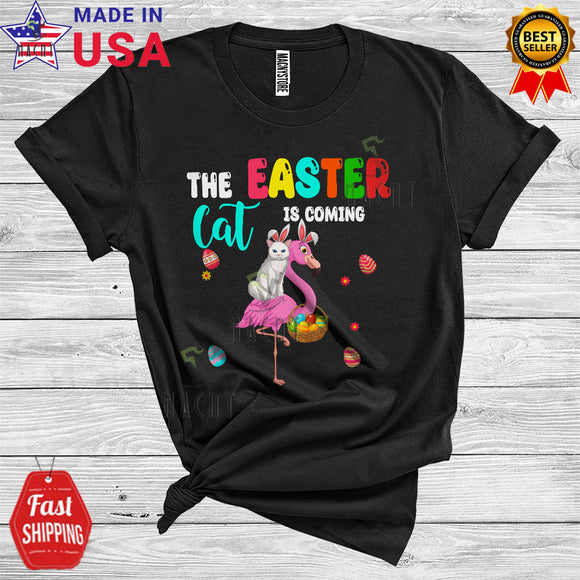 MacnyStore - The Easter Bunny Is Coming Cool Cute Easter Day Bunny Cat Riding Flamingo Hunting Easter Eggs Flowers T-Shirt
